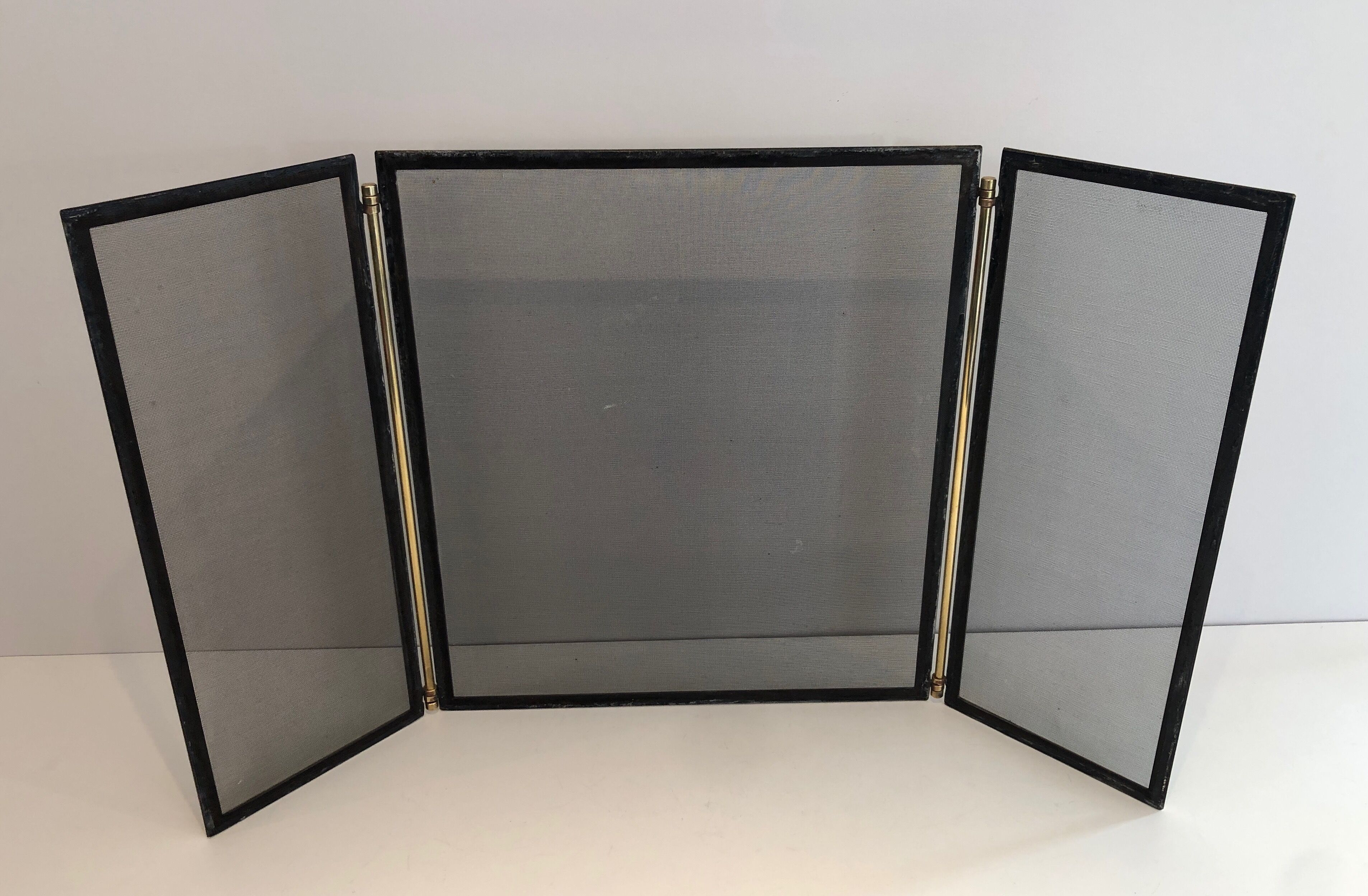 Brass and wire mesh firewall. french work. around 1970