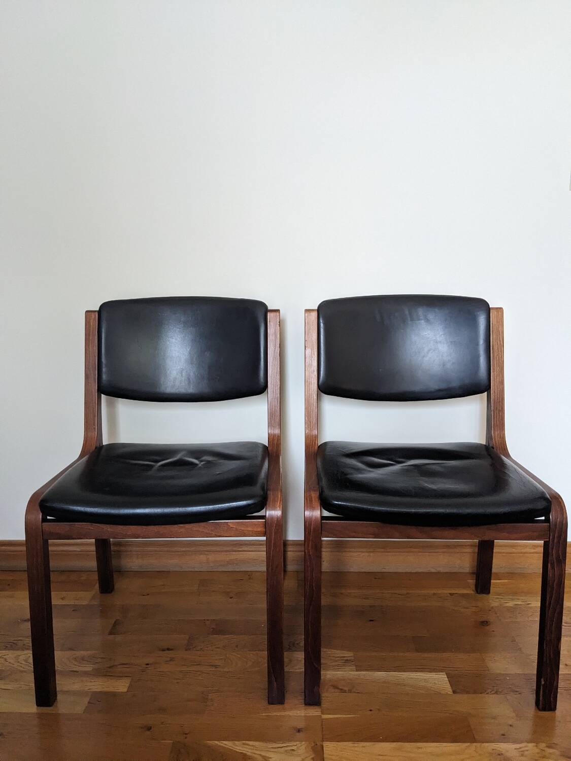 Vintage leather and wood chair pair