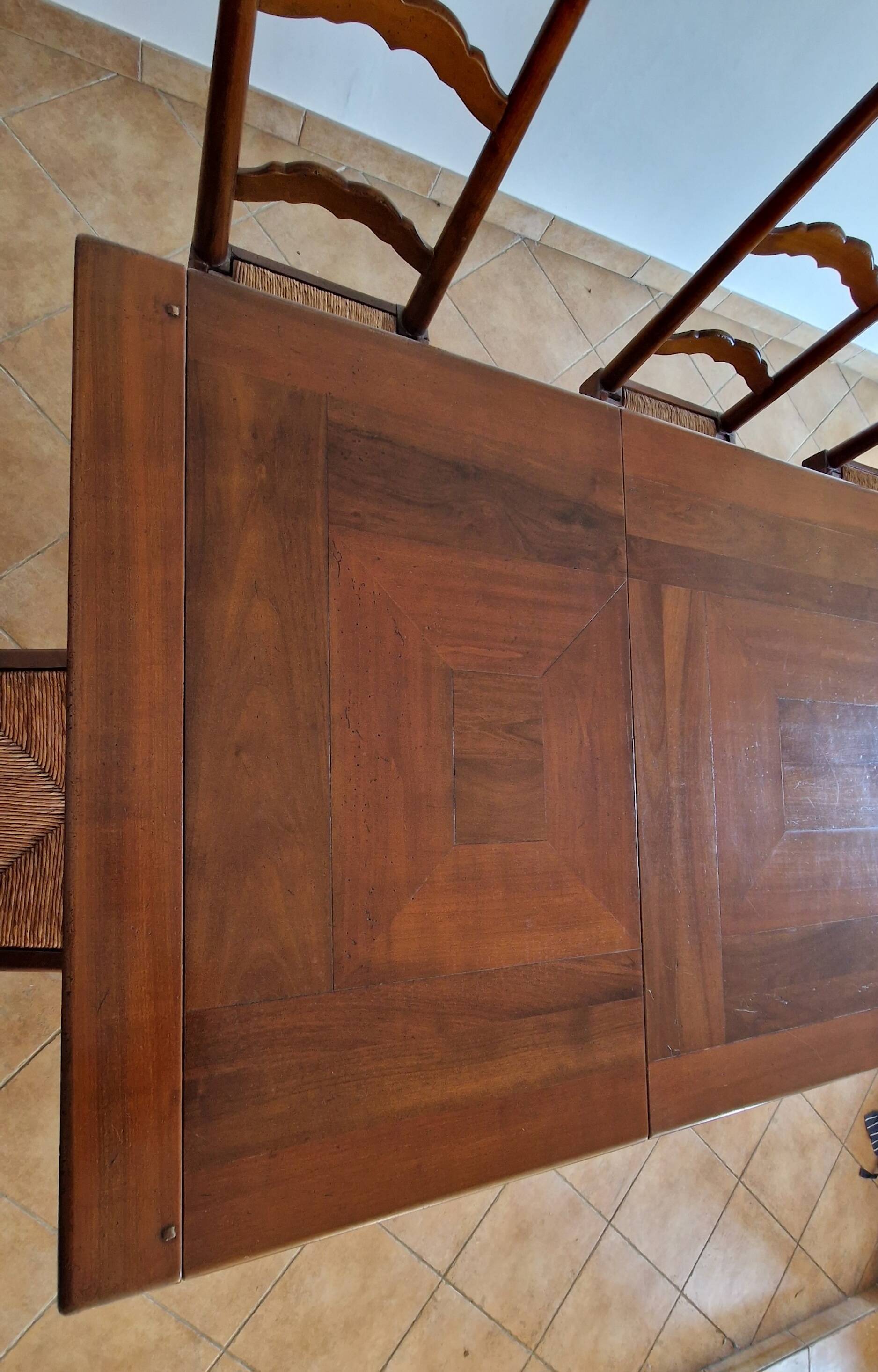 Marquetry wooden dining table with its 6 chairs.