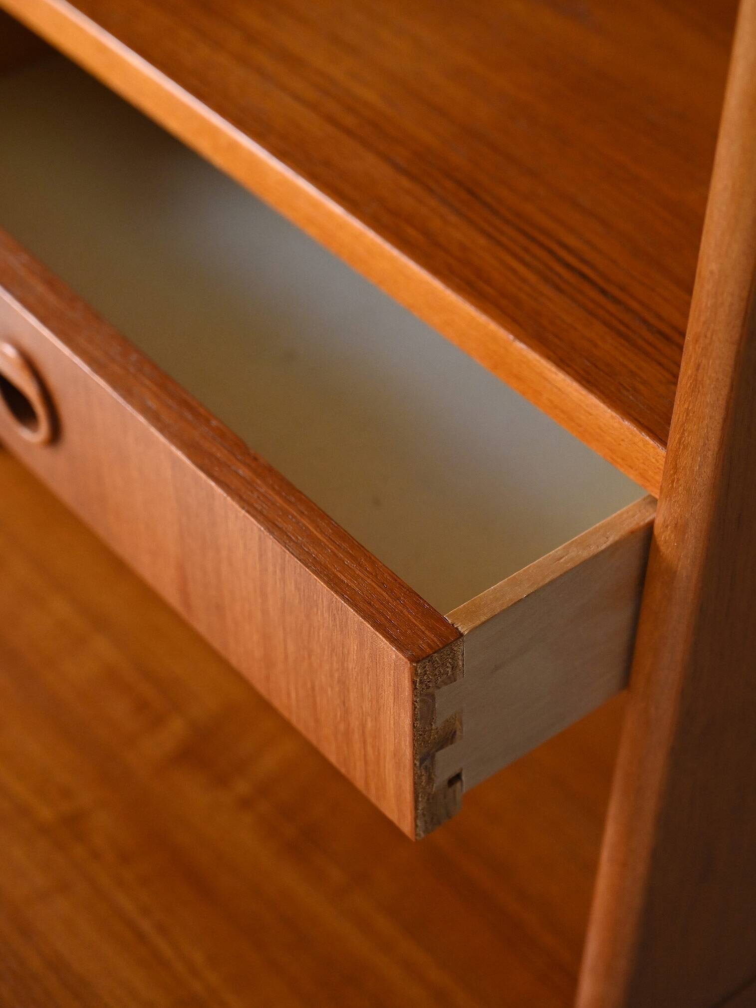 Fine teak bookcase with drawers