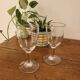 2 small stemmed glasses