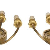 Pair of wall sconces with a relief decoration of a Bacchus mask.