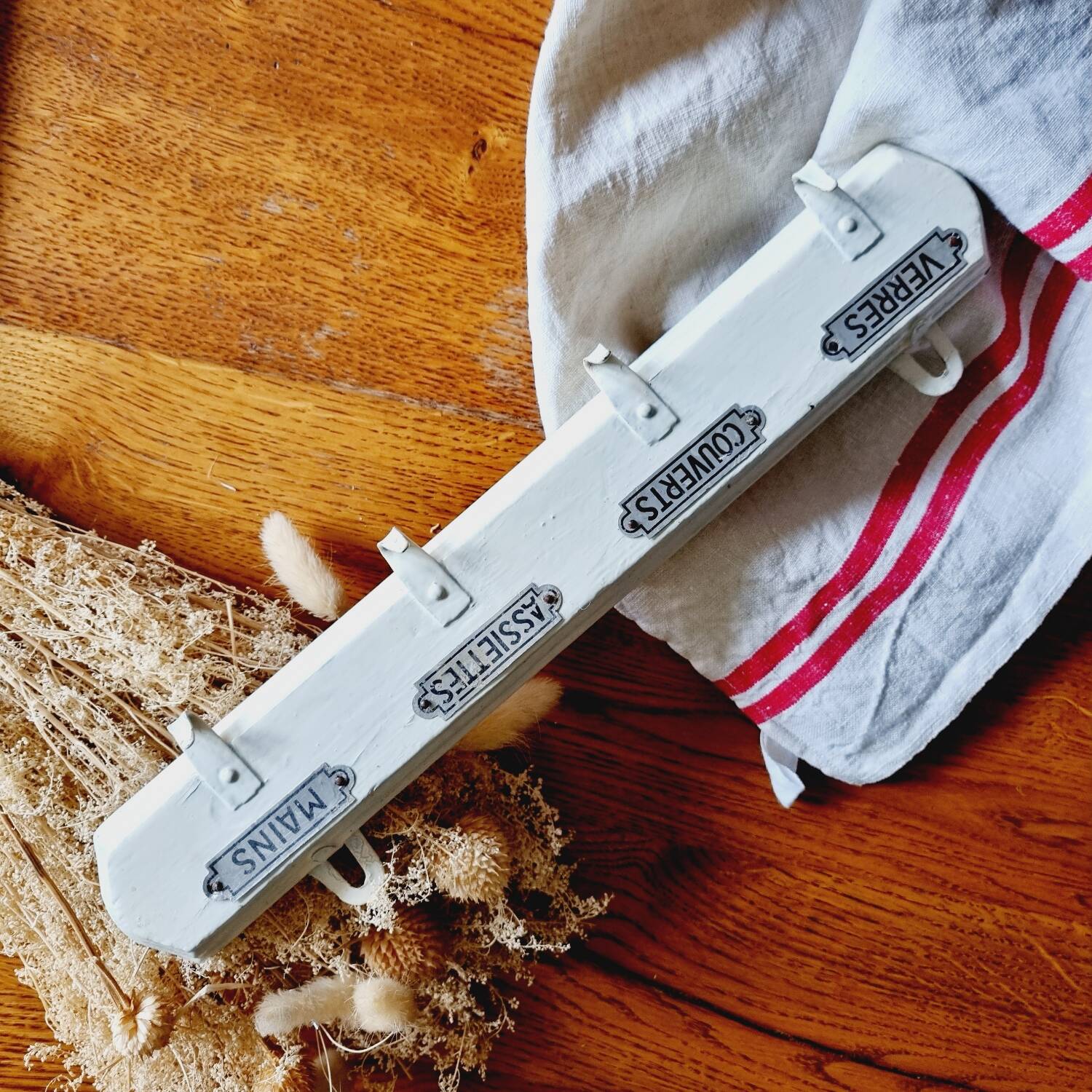 Old coat hook tea towel holder