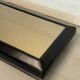 Vintage coffee table covered in leather, smoked mirror top and chrome legs.