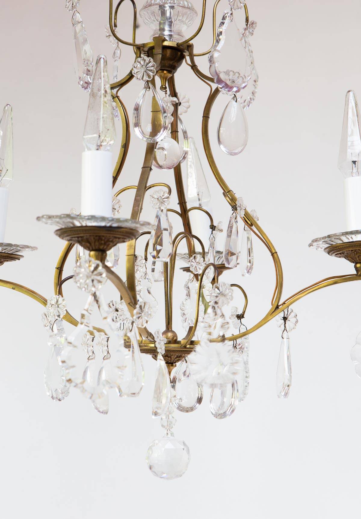 Old French chandelier in gilded brass with tassels