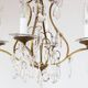 Old French chandelier in gilded brass with tassels