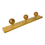 Wall coat rack with pine ball hook