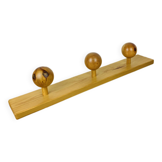 Wall coat rack with pine ball hook