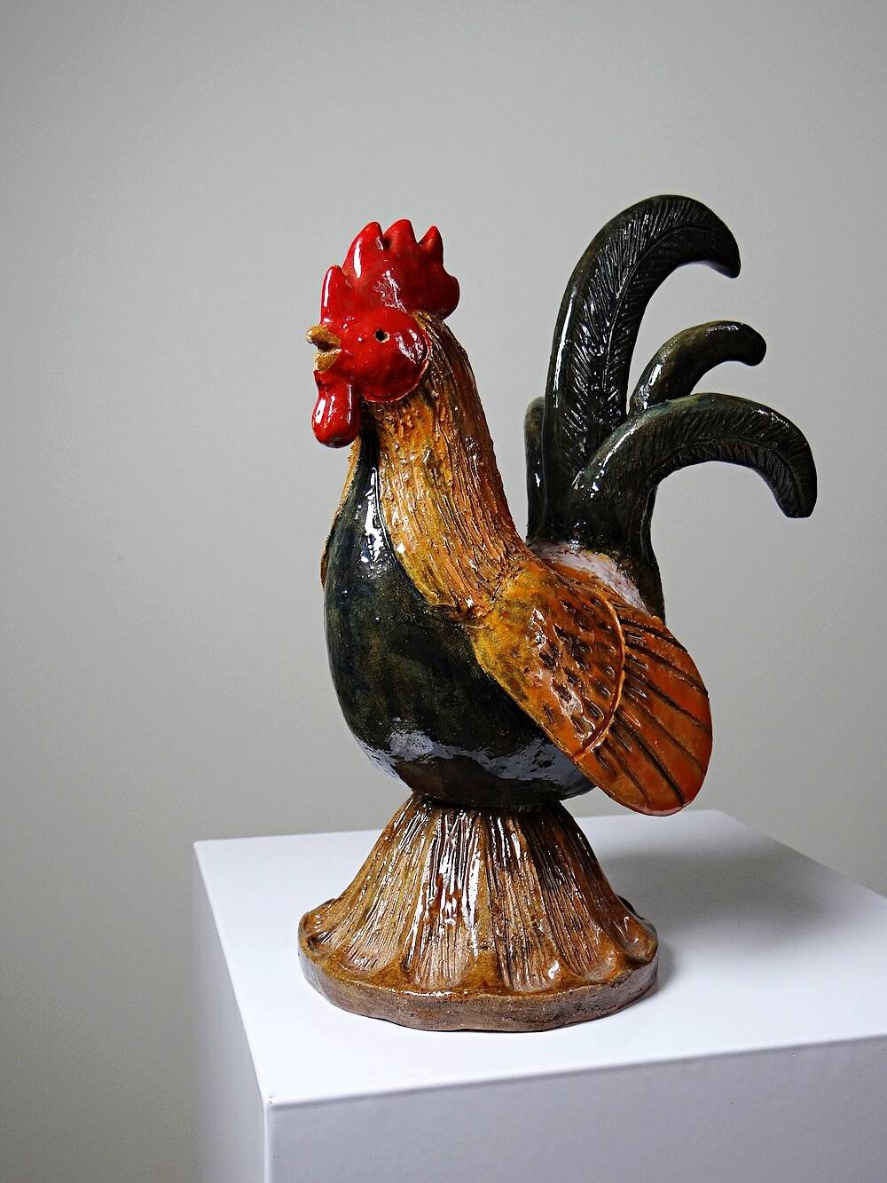Small decorative rooster in handcrafted enameled ceramic folk art