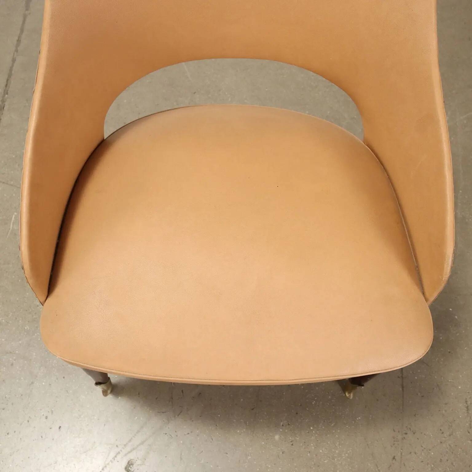 Pair of vintage armchairs from the 50s-60s in ebony wood, brass, with padded seats.