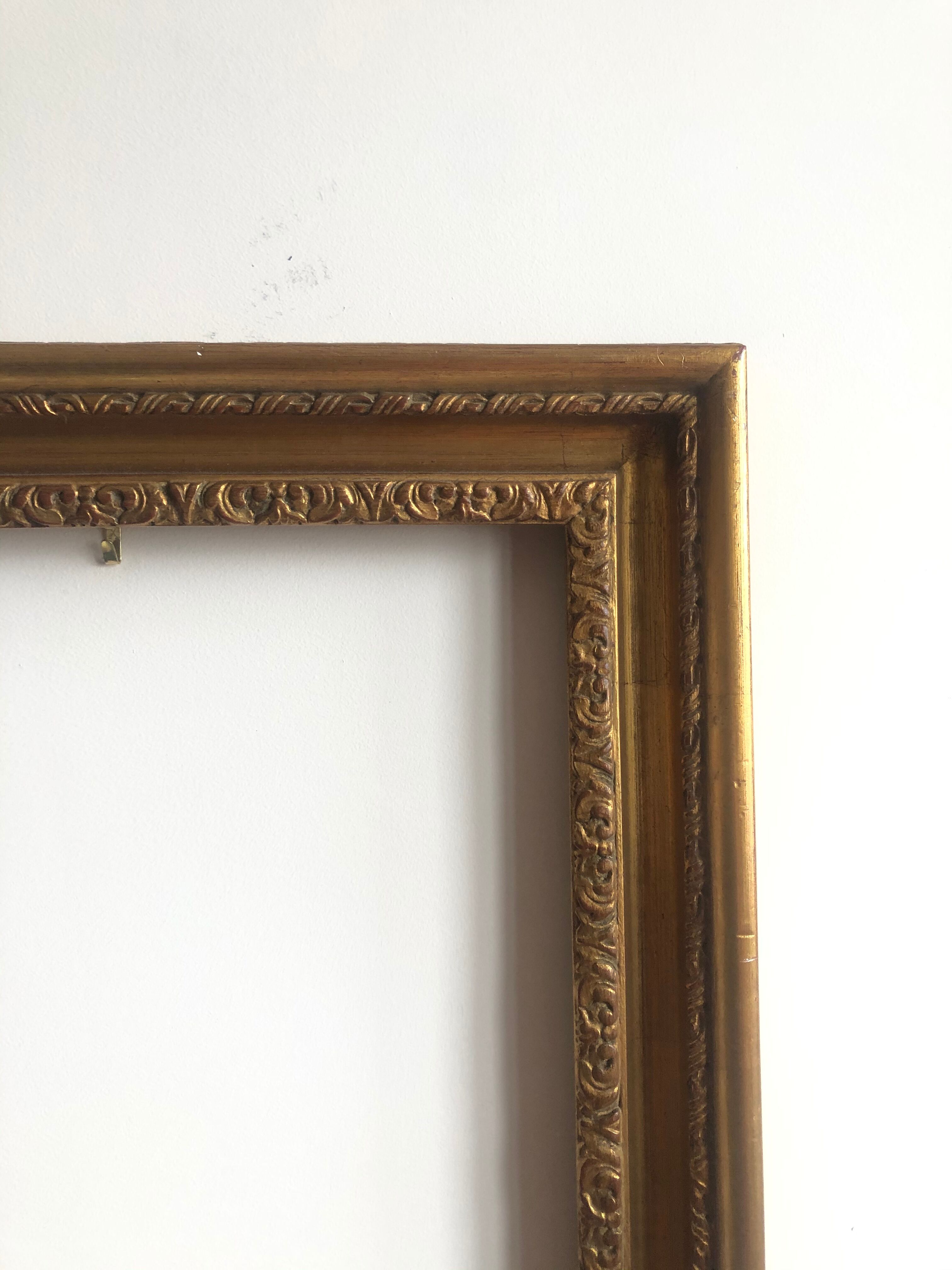 Wooden frame and gilded stucco