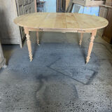 Oval wooden table on wheels.