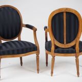 Pair of Louis XVI style cabriolet armchairs in natural wood.