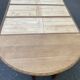 Round extendable dining table Napoleon III renovated in 19th-century oak.