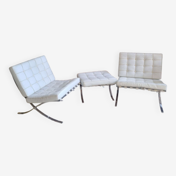 Pair of barcelona armchairs and its ottoman, by ludwig mies van der rohe circa 1980