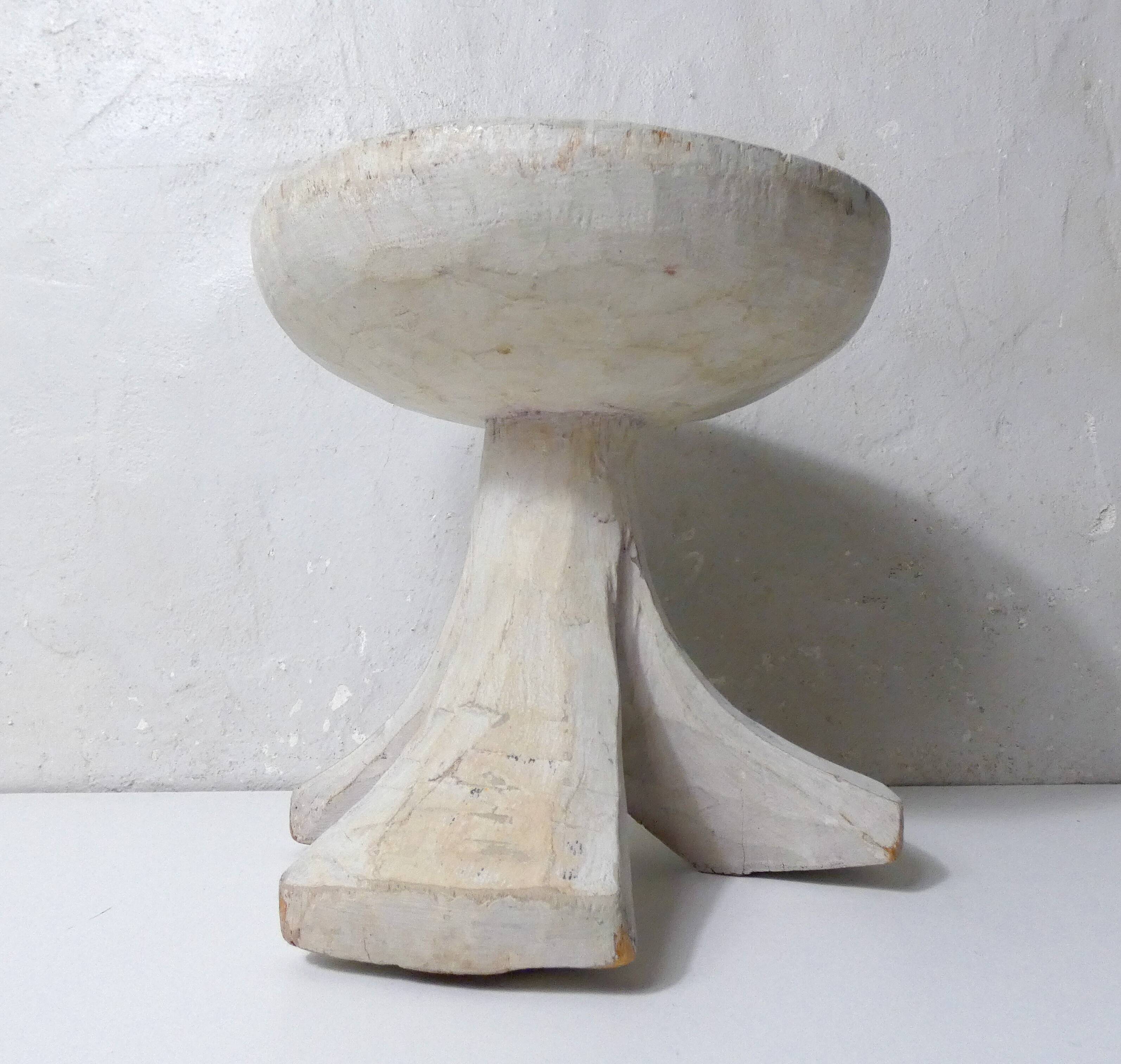 antique small tripod bench/stool in solid carved brutalist wood