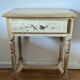 exotic wood console with a drawer