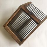 Old comb with berries (blueberries ..) in wood and metal