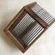 Old comb with berries (blueberries ..) in wood and metal