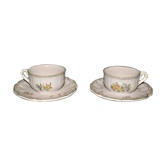 Two MOUSTIER cups decorated with flowers signed