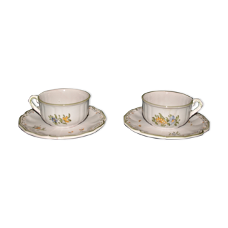 Two MOUSTIER cups decorated with flowers signed