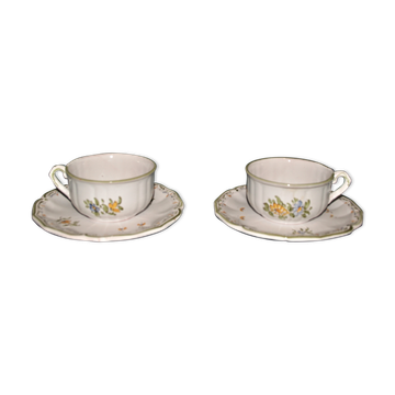 Two MOUSTIER cups decorated with flowers signed