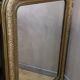 Old Louis Philippe style mirror in gilded wood with pediment