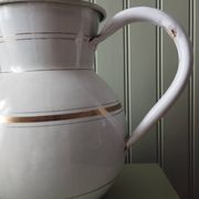 Rare large, pot-bellied toilet jug in white enamelled sheet metal with gold edging