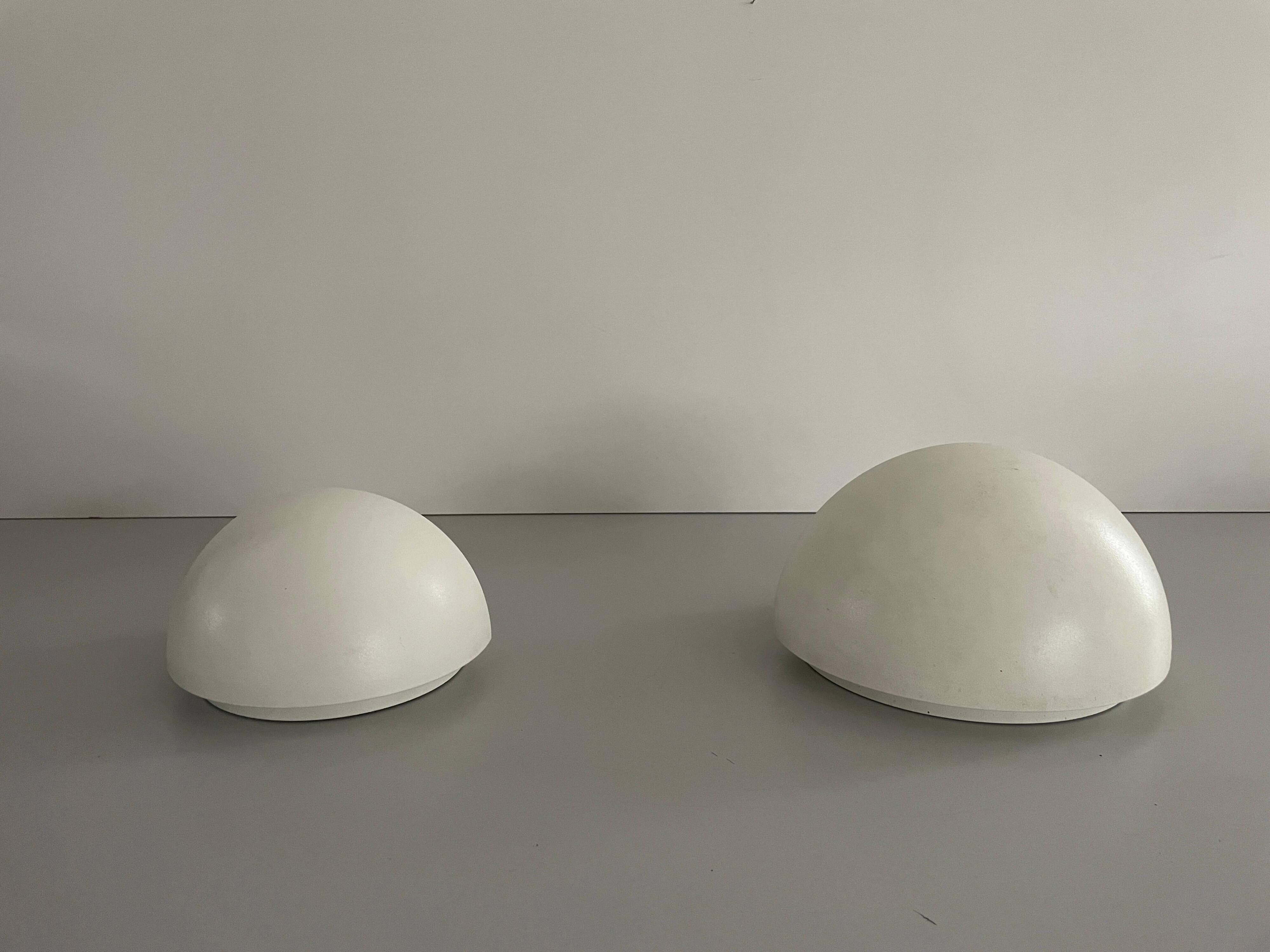 Round wall lights, small and large, in white metal by Bega, 1970s, Germany.