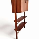 Small walnut and brass wall unit with desk function by William Watting