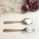 Set of 2 silver metal cutlery with punches