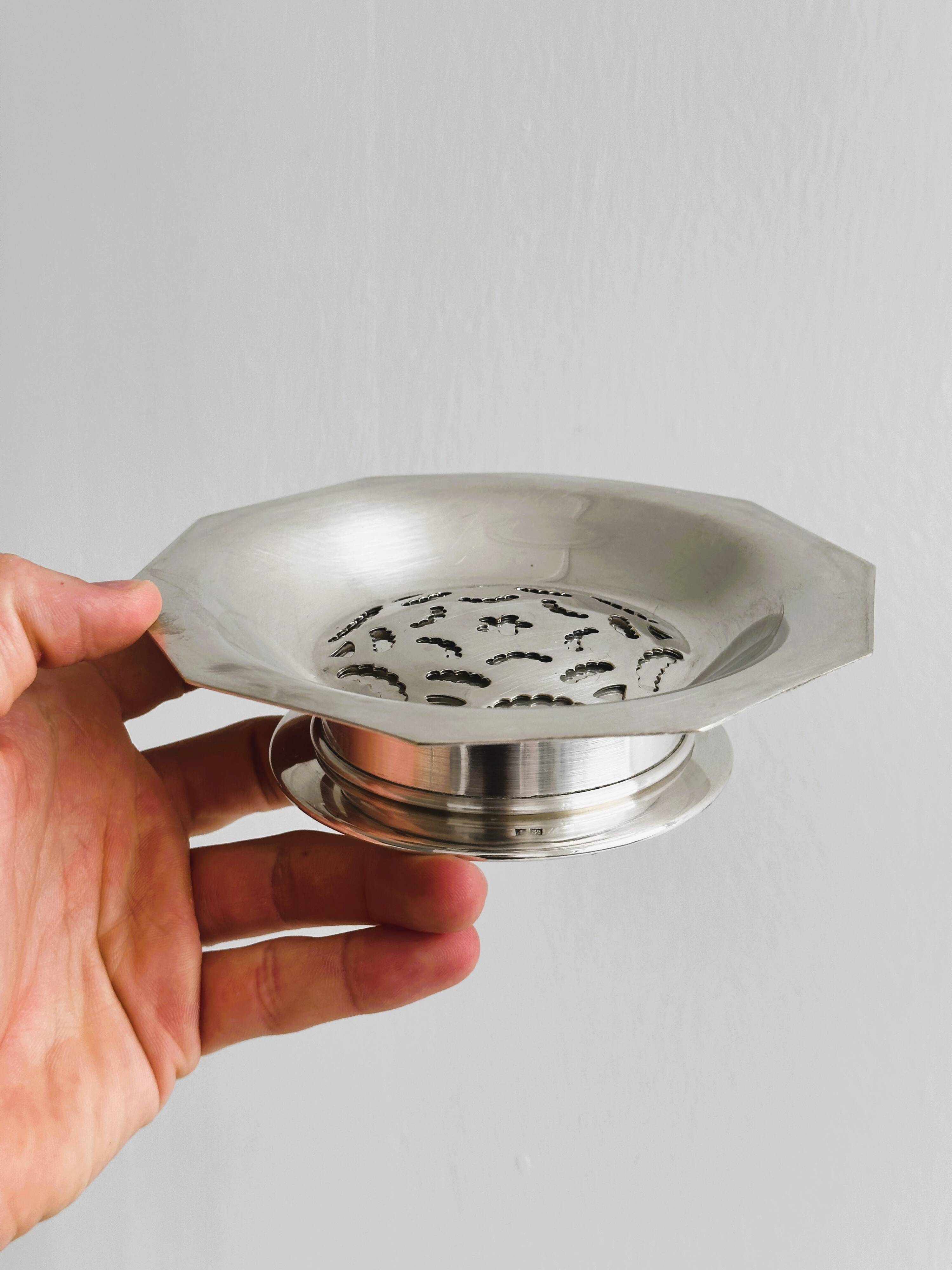 Antique butter dish in shiny metal