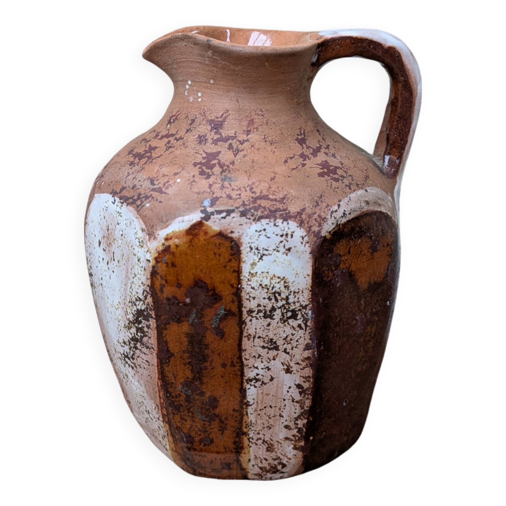 Old small pitcher in glazed terracotta
