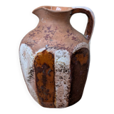 Old small pitcher in glazed terracotta