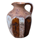 Old small pitcher in glazed terracotta