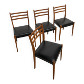 Set of 4 vintage Scandinavian chairs in wood and black faux leather.