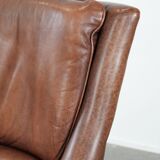 Cognac brown cow leather armchair with decorative nail finish