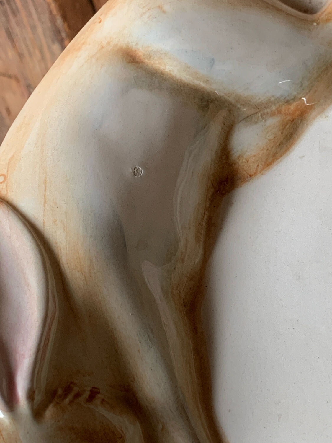 Very large serving dish with hares and vegetables.