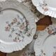 12 assiettes à dessert en porcelaine ancienne décor polychrome floral début XXe