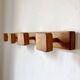 Wall-mounted coat rack with 4 wooden hooks