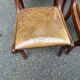 4 Regency chairs in solid wood and brown-beige leather from the 19th century.