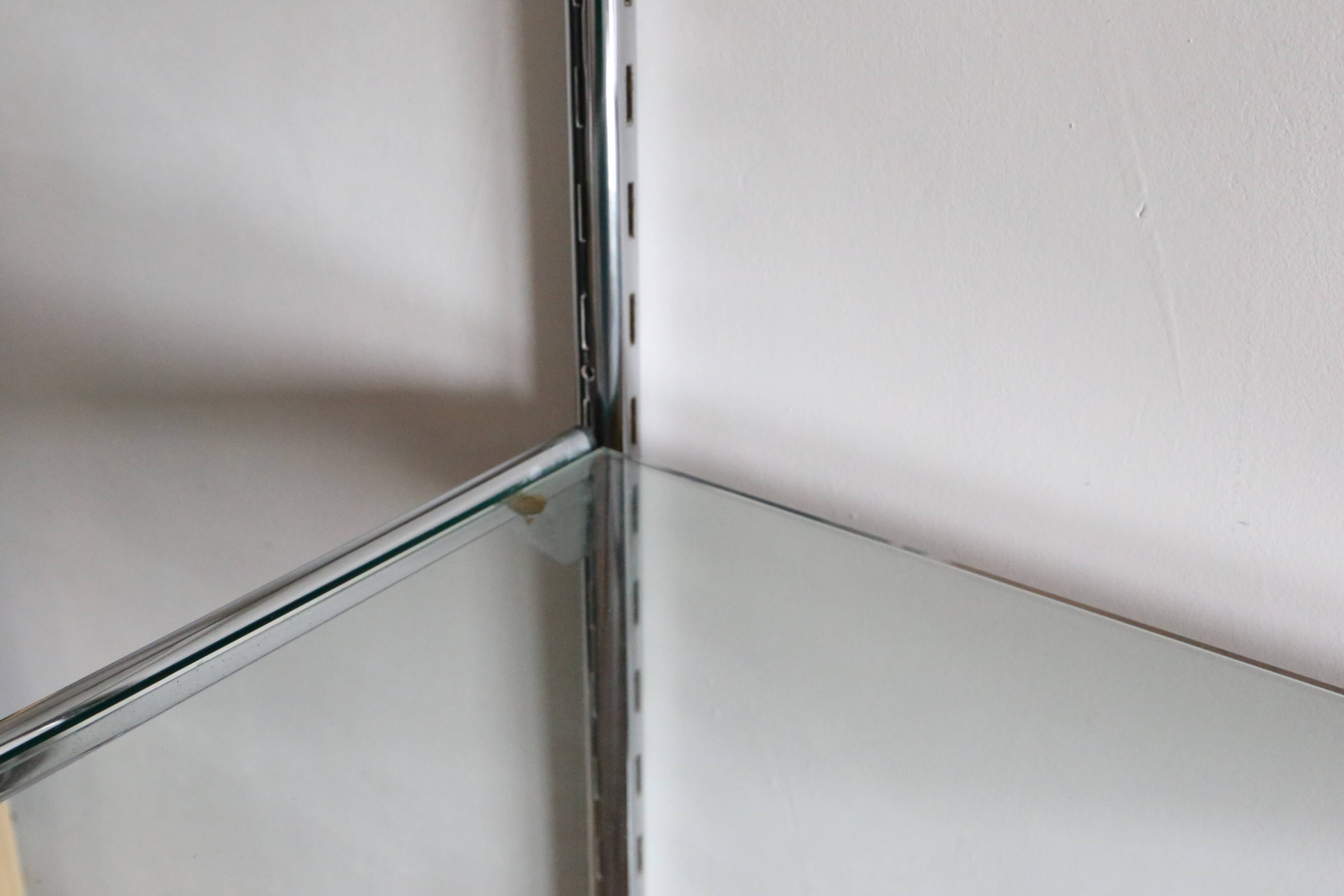 Chrome and glass wall shelf, circa 1960
