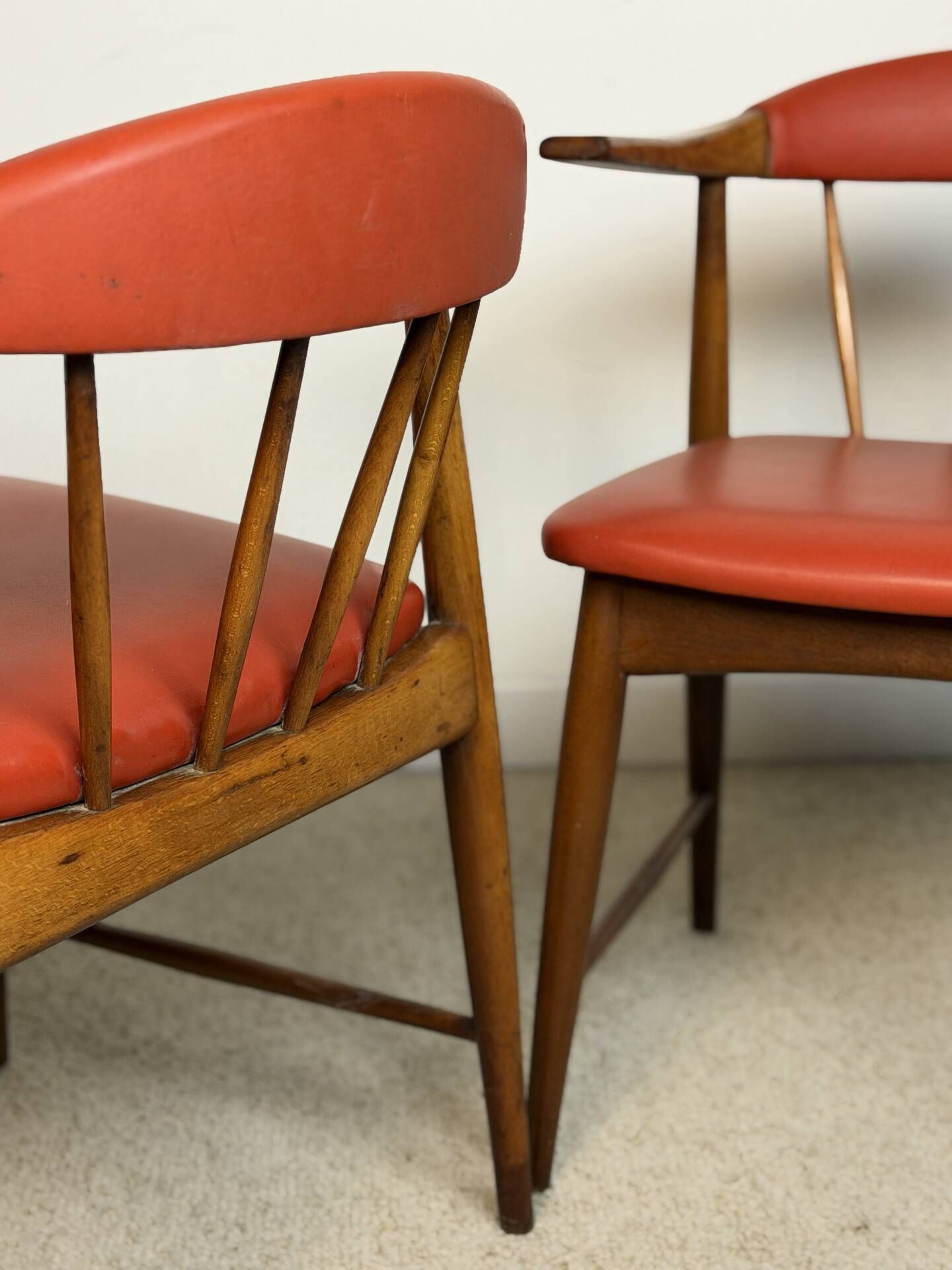 Pair of Scandinavian armchairs in teak and red faux leather – 1960s