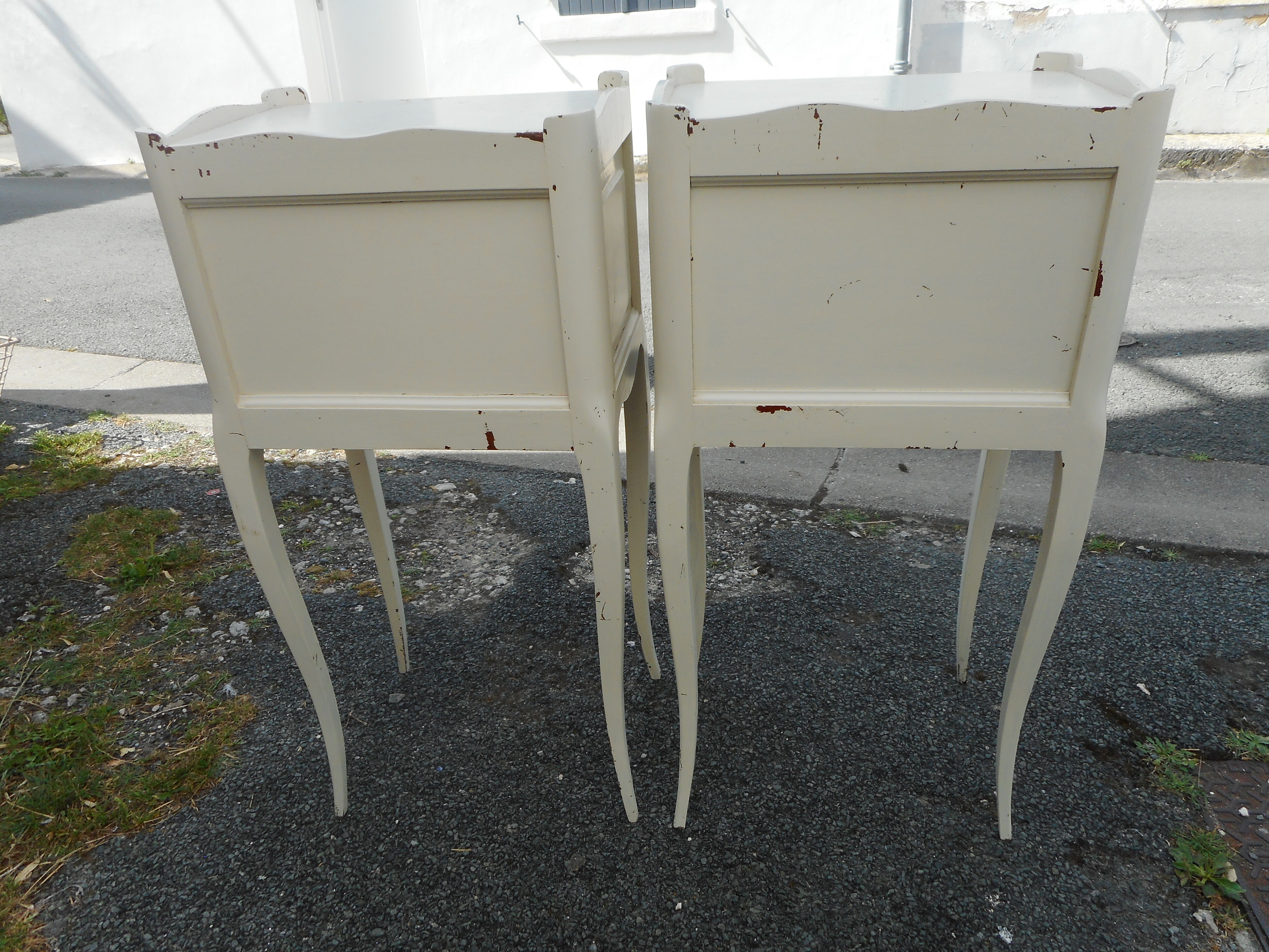 Pair of white lacquered bedside tables