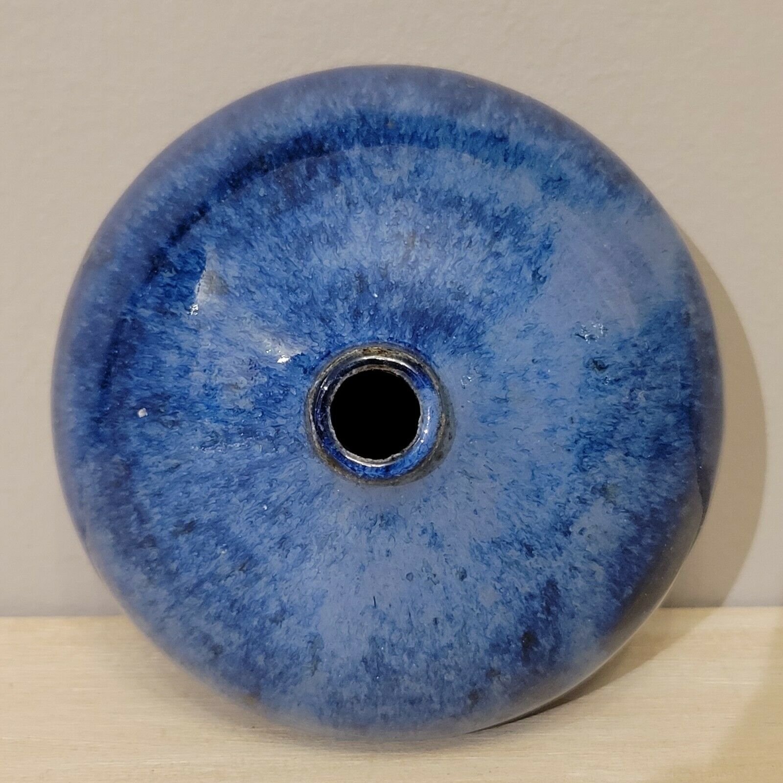 Small blue enamelled ceramic ball vase