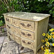 Curved antique commode in pistachio green patina.