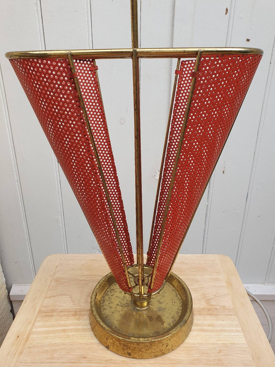 Perforated metal umbrella stand and scoubidou