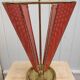 Perforated sheet metal umbrella stand and scoubidou