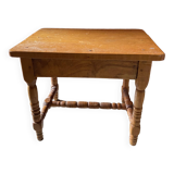 Small footrest bench in bohemian style.