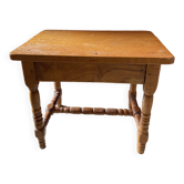 Small footrest bench in bohemian style.